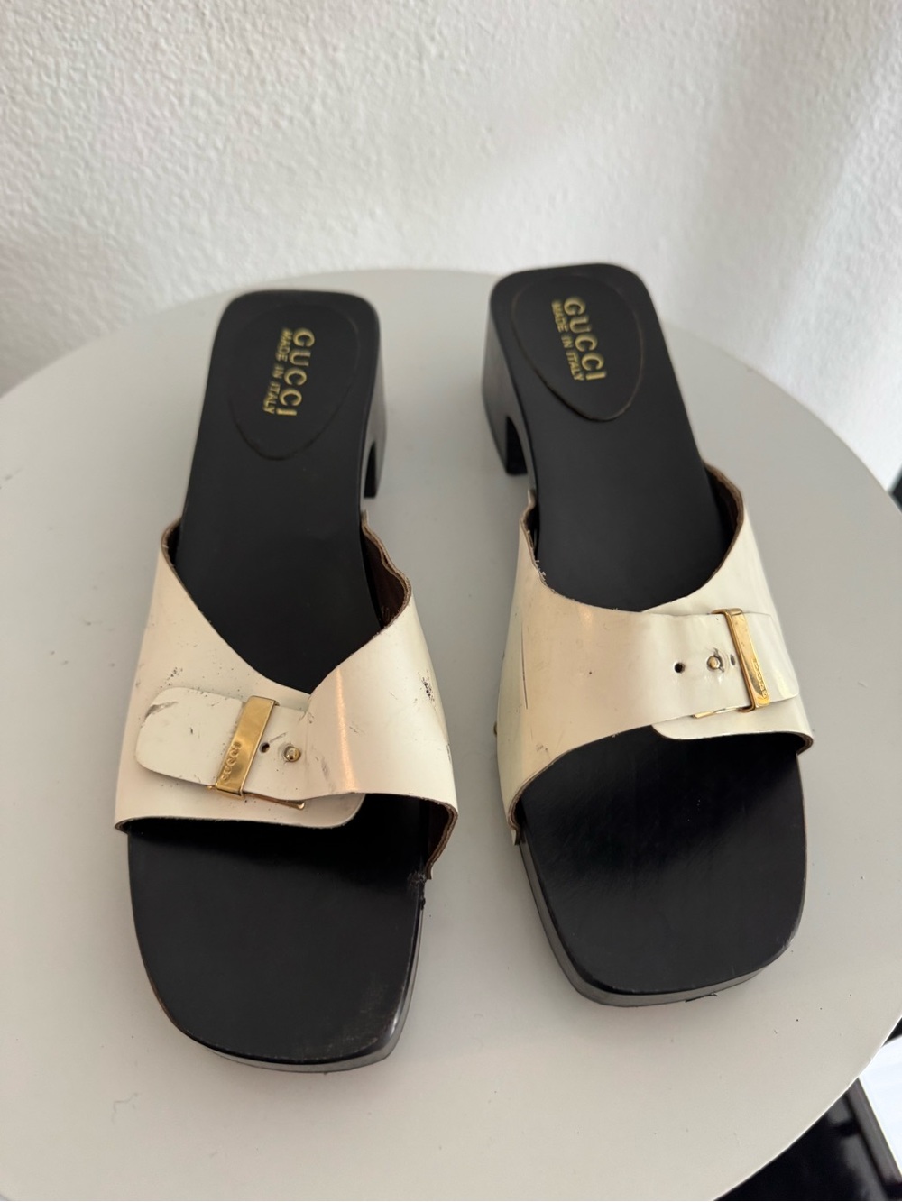 Gucci Cream Leather Buckle Slide Mules with Black Footbed